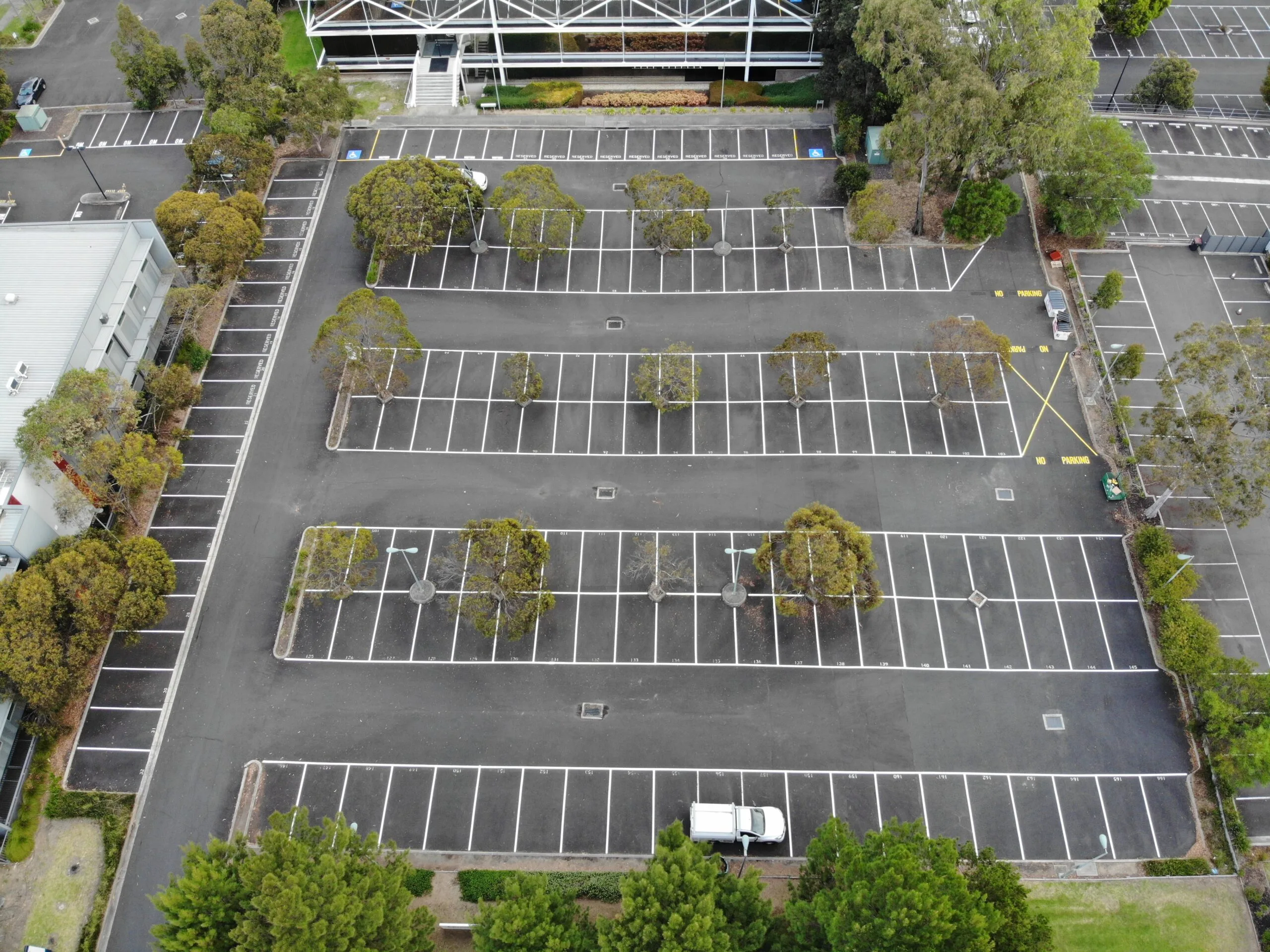 Aerial view of new car park line marking for commercial car park