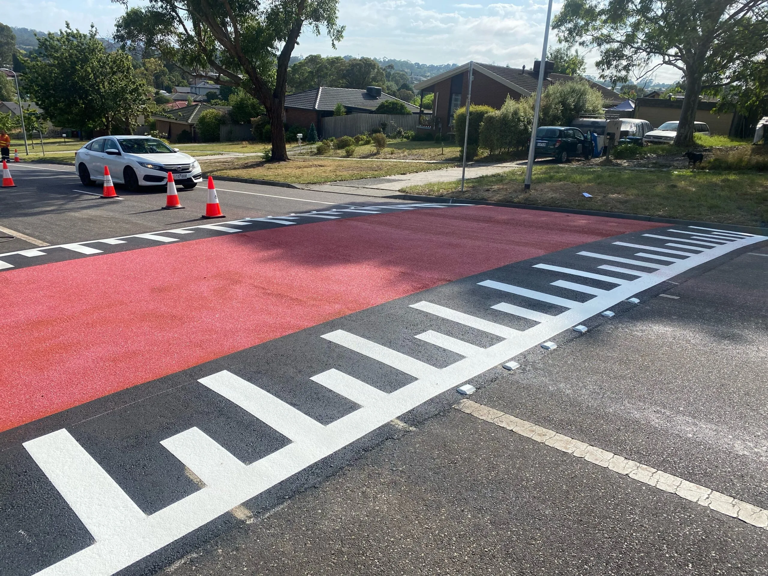 Red and white road line marking for speed hump
